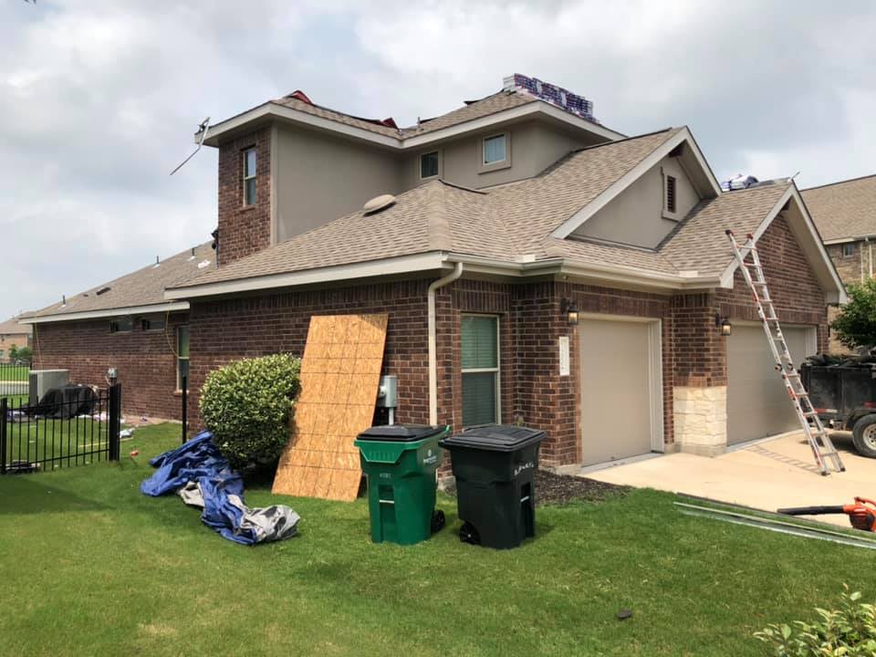 Contractor atop a roof